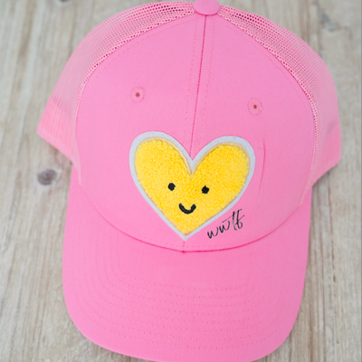 Find the Yellow Trucker Hat – Pink